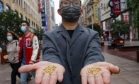 警醒世人粮食可贵 艺术家计划将1000颗纯金大米投入黄浦江