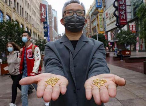 警醒世人粮食可贵 艺术家计划将1000颗纯金大米投入黄浦江